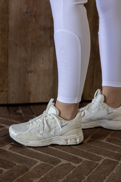 Damskie bryczesy Kentucky Miami z kolanowym lejem - białe