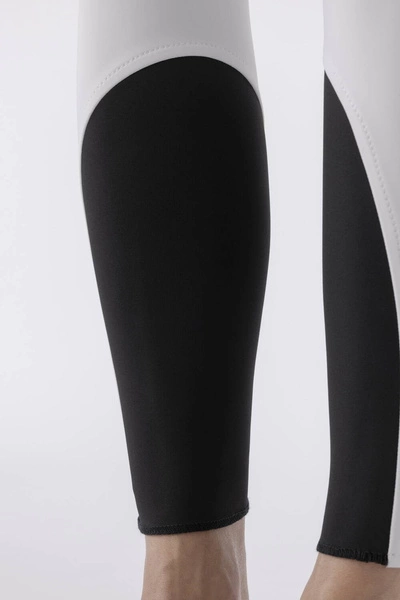 Damskie bryczesy Equiline Atirk z kolanowym lejem X-Grip - białe