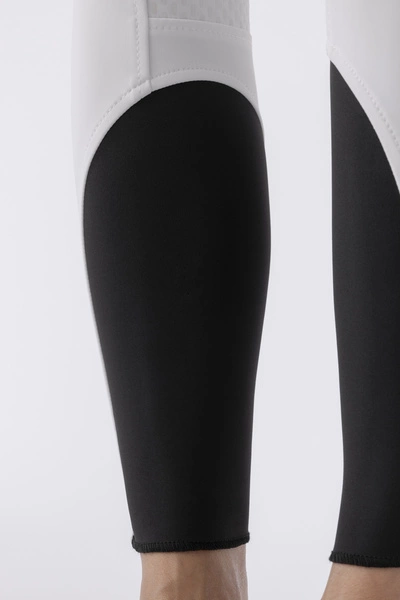 Damskie bryczesy Equiline Adellek z wysokim stanem z pełnym lejem X-Grip - białe